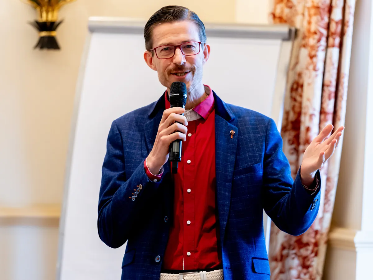 Rainer Maria Morita speaking at the conference Added Value, September 2025